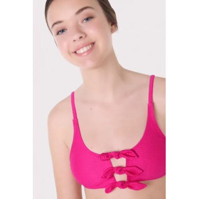 Top bikini juvenil texturizado detalles lazos fucsia